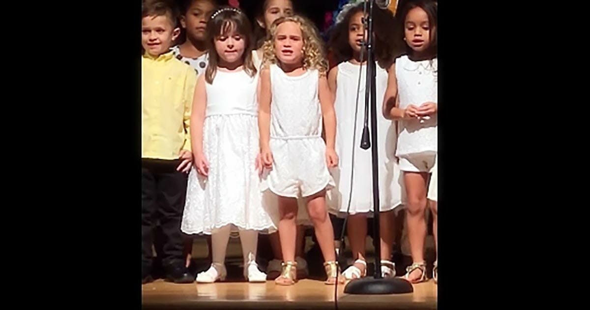 Kindergarten girls took to the stage to perform a song - the little blonde in the middle captured the hearts of the internet